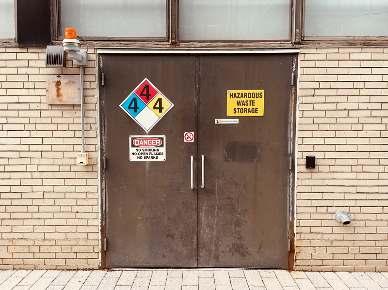 Hazardous waste warnings on doors