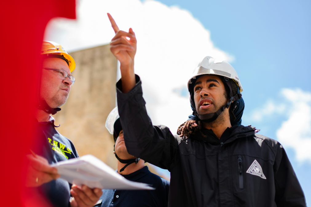 workers discussing centrifugal pump nameplate at a jobsite